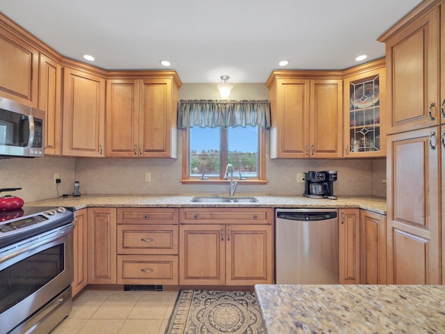 229 Eldred Yulan Rd, Eldred, NY 12792 - kitchen featuring appliances with stainless steel finishes, a sink, light stone counters, tasteful backsplash, and recessed lighting