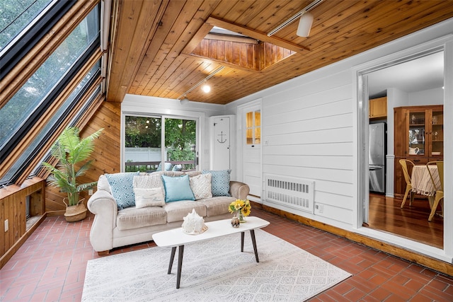 208 Wagner Ave, Mamaroneck, NY 10543 - living room featuring radiator heating unit, wood ceiling, brick floors, wood walls, and a skylight