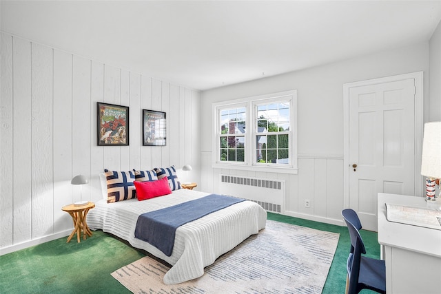 208 Wagner Ave, Mamaroneck, NY 10543 - bedroom featuring radiator, carpet flooring, an office area, wood walls, and baseboards