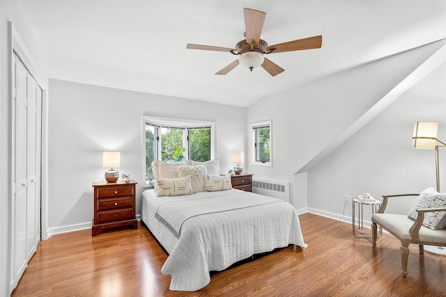208 Wagner Ave, Mamaroneck, NY 10543 - bedroom featuring radiator heating unit, a closet, baseboards, a ceiling fan, and lofted ceiling