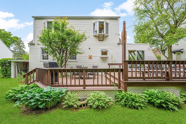 208 Wagner Ave, Mamaroneck, NY 10543 - rear view of house featuring a wooden deck and a lawn