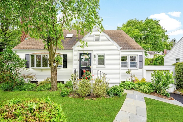 208 Wagner Ave, Mamaroneck, NY 10543 - view of front of property with a shingled roof and a front lawn