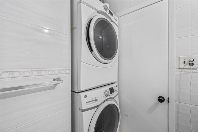 175 Frederick Ave, South Floral Park, NY 11001 - clothes washing area featuring stacked washer / dryer