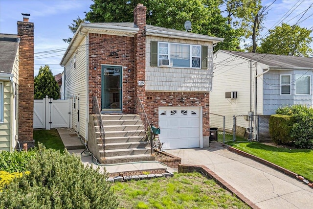 175 Frederick Ave, South Floral Park, NY 11001 - view of front of home featuring a gate, concrete driveway, fence, an attached garage, and brick siding