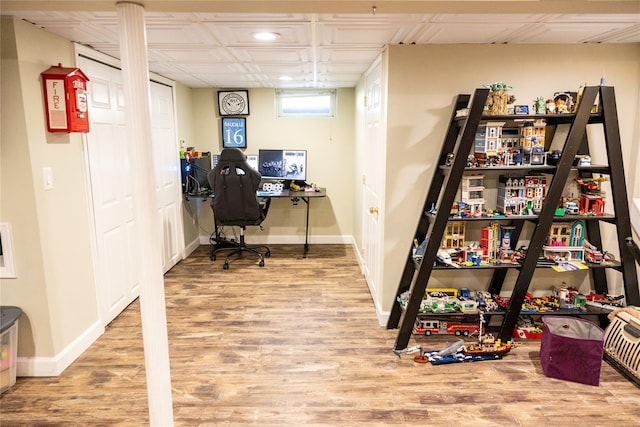 office space featuring wood finished floors, recessed lighting, and baseboards