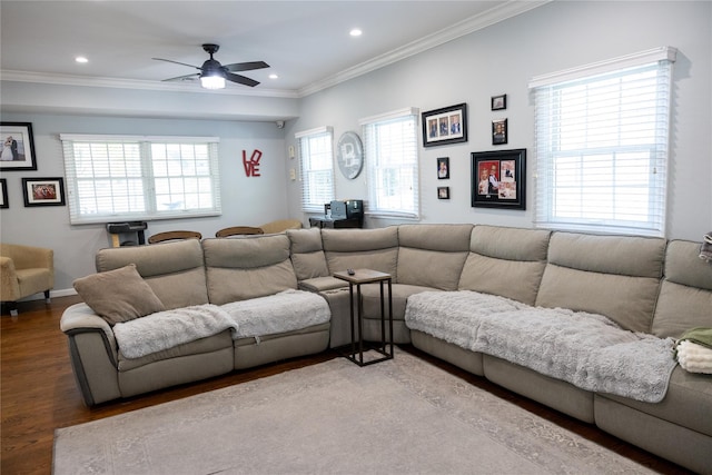 living area featuring wood finished floors, ornamental molding, a ceiling fan, recessed lighting, and baseboards