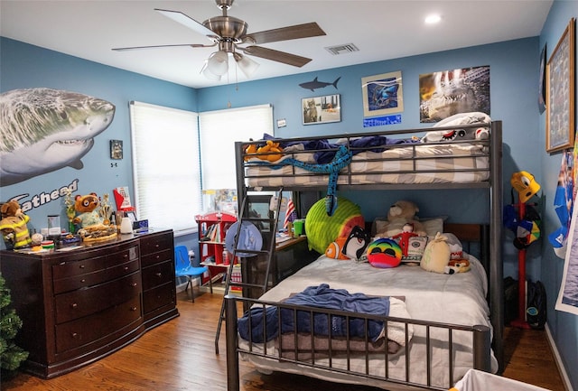 bedroom with wood finished floors and ceiling fan