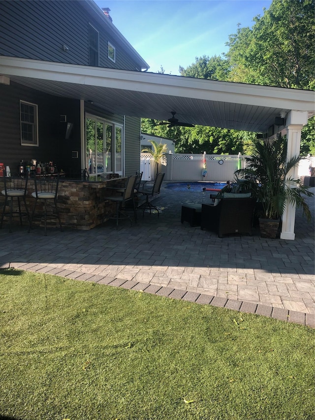 view of patio with a ceiling fan
