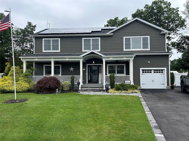 52 S Windhorst Ave, Bethpage, NY 11714 - view of front of property with a garage, covered porch, a front yard, and roof mounted solar panels