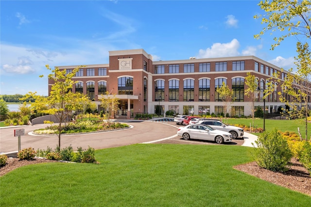 view of property featuring uncovered parking