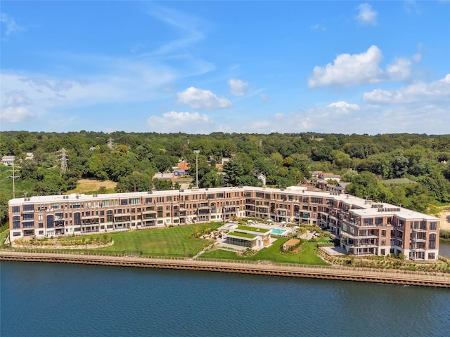 bird's eye view of a nearby body of water and a forest