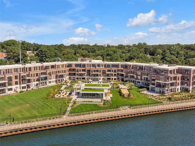 bird's eye view of a large body of water and apartment complex / building