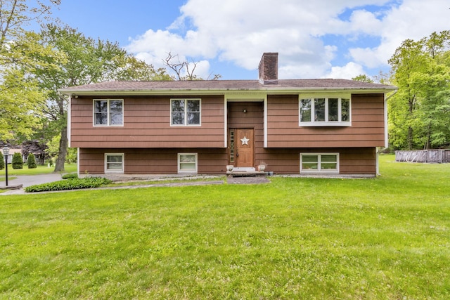 122 Minor Rd, Brewster, NY 10509 - back of property with a chimney and a lawn