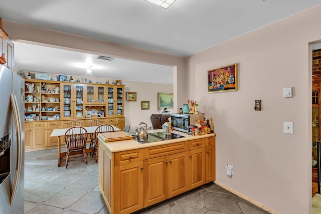 122 Minor Rd, Brewster, NY 10509 - kitchen featuring stainless steel fridge with ice dispenser, black electric cooktop, a peninsula, light countertops, and an office area