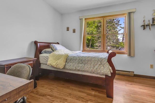 122 Minor Rd, Brewster, NY 10509 - bedroom featuring baseboard heating, wood finished floors, and baseboards
