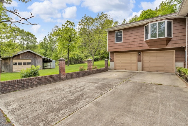 122 Minor Rd, Brewster, NY 10509 - view of property exterior featuring a lawn, driveway, and an attached garage