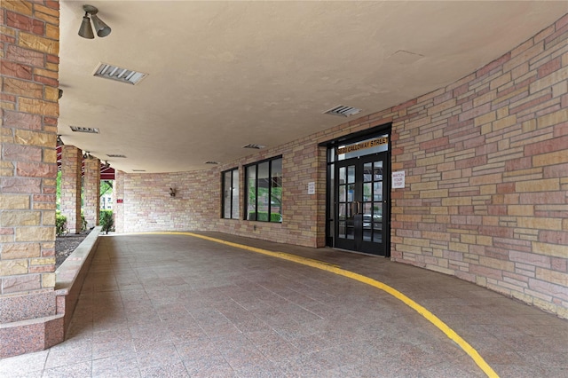 58-03 Calloway St Unit 3Nn, Corona, NY 11368 - view of exterior entry featuring brick siding and french doors