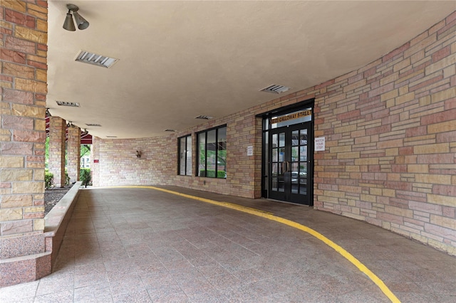 58-03 Calloway St Unit 3Nn, Corona, NY 11368 - view of exterior entry featuring brick siding and french doors