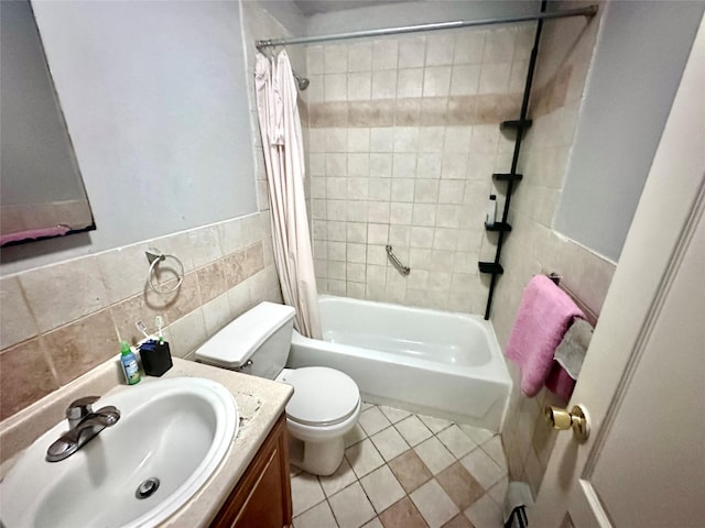1903 Arnow Ave, Bronx, NY 10469 - full bathroom featuring shower / bath combo, toilet, tile walls, vanity, and tile patterned flooring