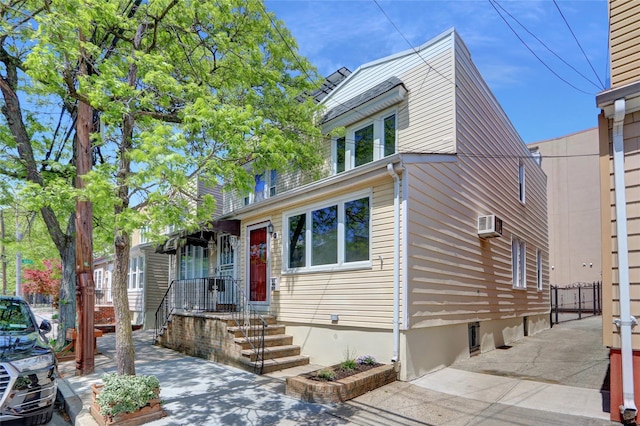 62-33 59th Dr, Maspeth, NY 11378 - view of front of home featuring an AC wall unit