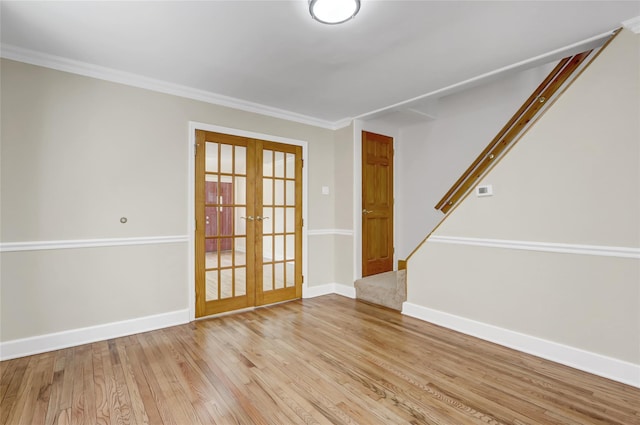 62-33 59th Dr, Maspeth, NY 11378 - unfurnished room with french doors, stairs, light wood-style flooring, baseboards, and crown molding