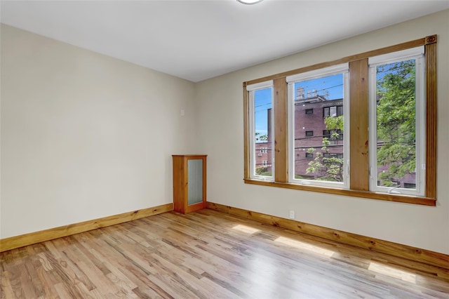 62-33 59th Dr, Maspeth, NY 11378 - empty room featuring baseboards and light wood-type flooring