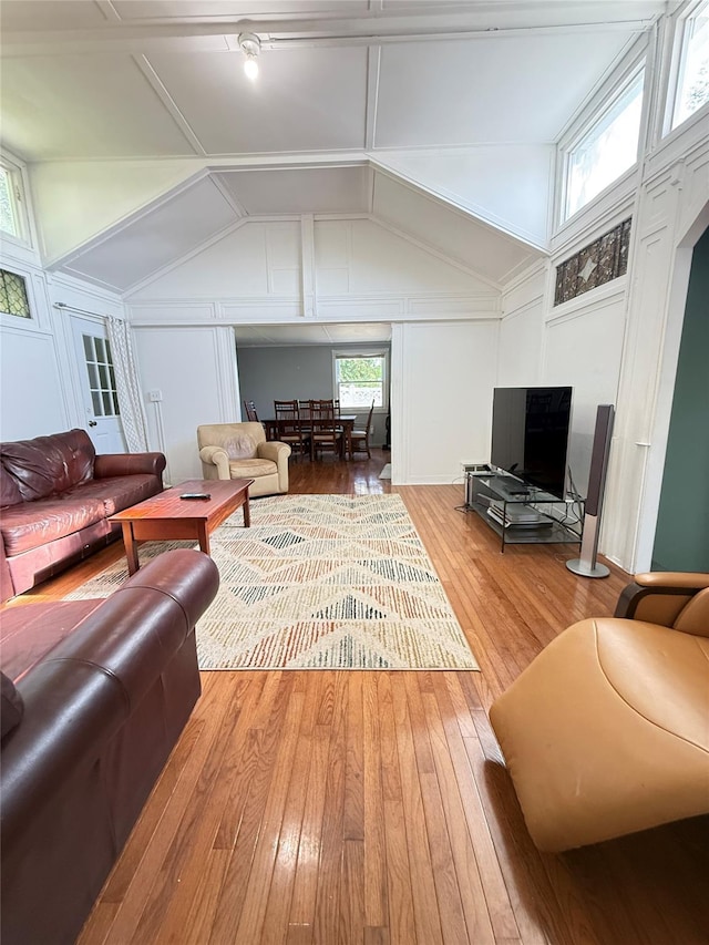 37 New Ave, Yonkers, NY 10704 - living area with a decorative wall, hardwood / wood-style flooring, and lofted ceiling