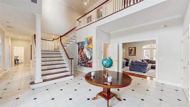 406 Duck Pond, Locust Valley, NY 11560 - entrance foyer featuring crown molding, stairway, baseboards, a towering ceiling, and light tile patterned flooring