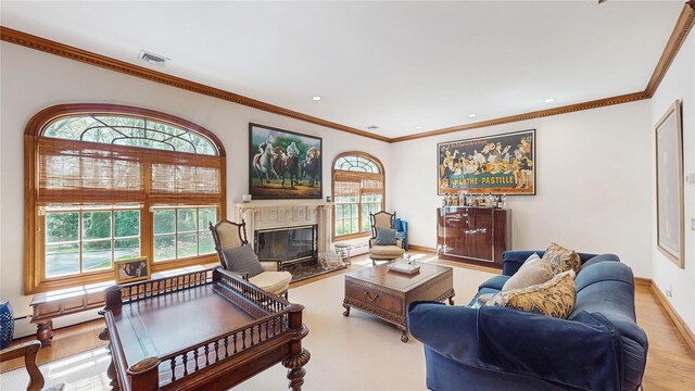 406 Duck Pond, Locust Valley, NY 11560 - living room featuring ornamental molding, a glass covered fireplace, recessed lighting, baseboards, and wood finished floors
