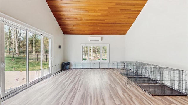 406 Duck Pond, Locust Valley, NY 11560 - unfurnished living room featuring lofted ceiling, a wall mounted air conditioner, wood finished floors, and wooden ceiling