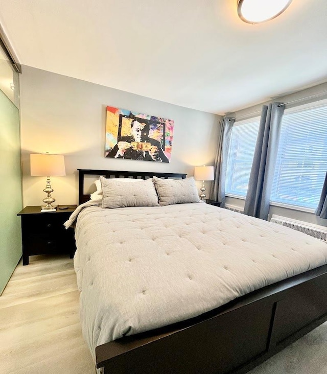 bedroom with light wood-type flooring