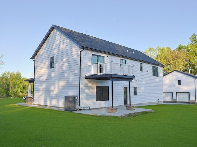 57 S Searsville Rd, Montgomery, NY 12549 - rear view of house with a balcony, central AC, a yard, and a patio area