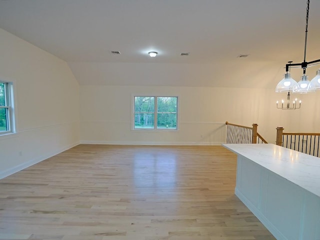 57 S Searsville Rd, Montgomery, NY 12549 - spare room featuring light wood-style floors, a chandelier, lofted ceiling, and baseboards