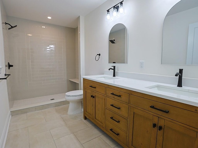 57 S Searsville Rd, Montgomery, NY 12549 - bathroom with toilet, tiled shower, double vanity, and tile patterned flooring