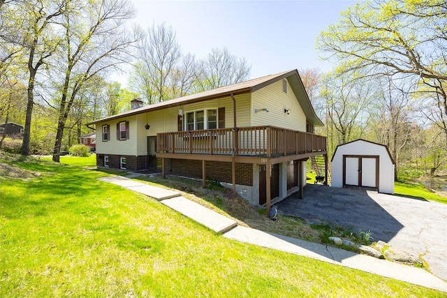 view of front of home with an outdoor structure, a shed, a chimney, a wooden deck, and a front yard
