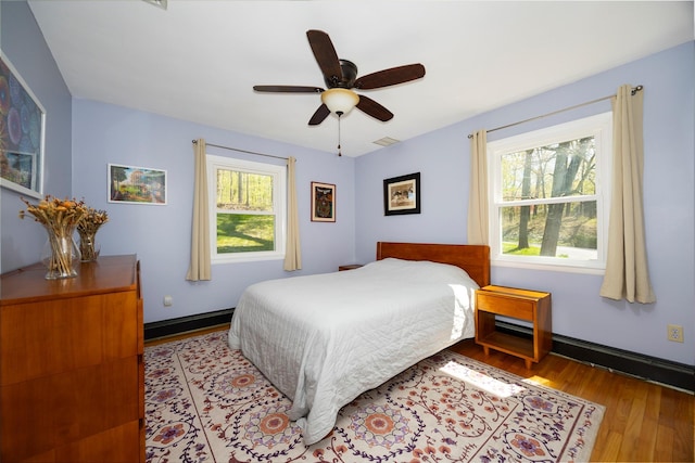 bedroom with wood finished floors and ceiling fan