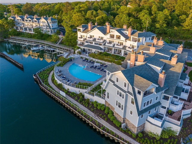 67 Old Boathouse Ln N, Hampton Bays, NY 11946 - drone / aerial view of a pool, a nearby body of water, and a heavily wooded area