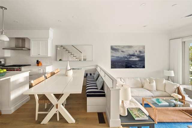 67 Old Boathouse Ln N, Hampton Bays, NY 11946 - living area with ornamental molding and wood finished floors