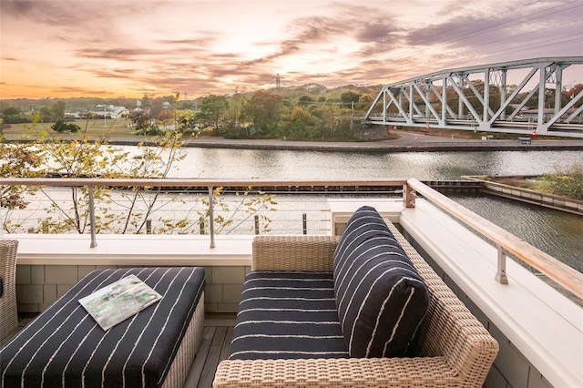 67 Old Boathouse Ln N, Hampton Bays, NY 11946 - balcony at dusk with a water view