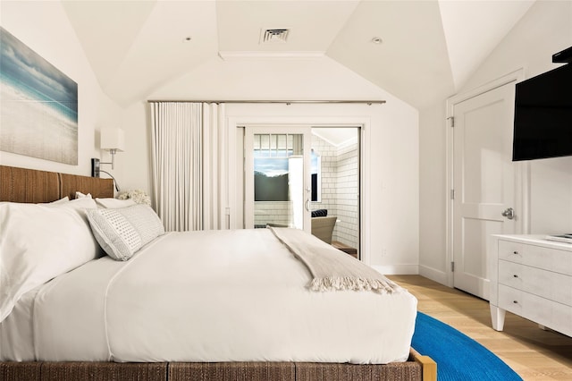 67 Old Boathouse Ln N, Hampton Bays, NY 11946 - bedroom with lofted ceiling, access to outside, light wood finished floors, and baseboards