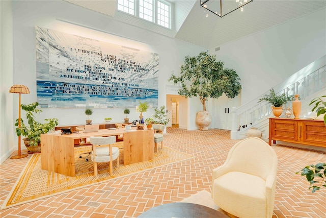 67 Old Boathouse Ln N, Hampton Bays, NY 11946 - common area with a towering ceiling and stairs