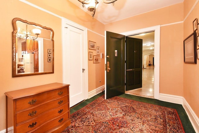 37BROMPTON Road 5-B, Great Neck, NY 11021 - hallway featuring a chandelier and baseboards