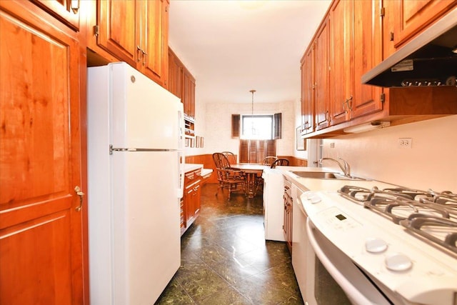 37BROMPTON Road 5-B, Great Neck, NY 11021 - kitchen with white appliances, a sink, under cabinet range hood, brown cabinetry, and pendant lighting
