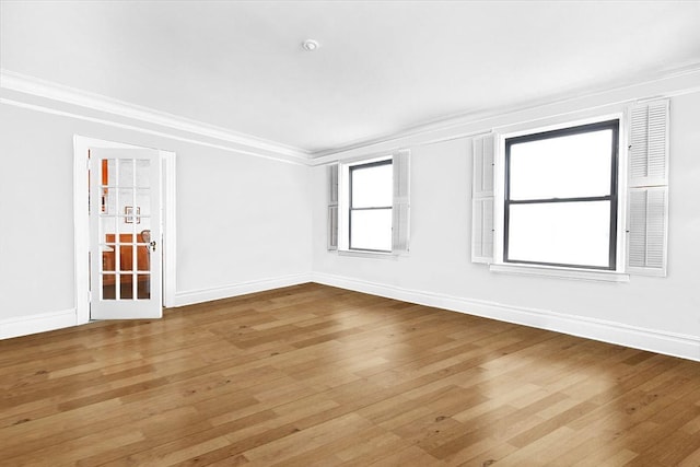 37BROMPTON Road 5-B, Great Neck, NY 11021 - spare room with crown molding, wood-type flooring, and baseboards