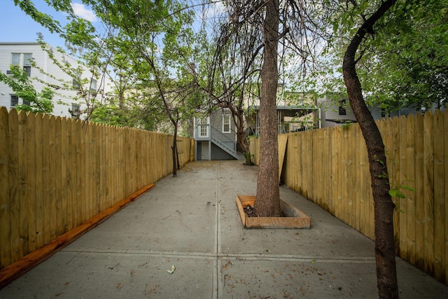 view of side of property featuring fence