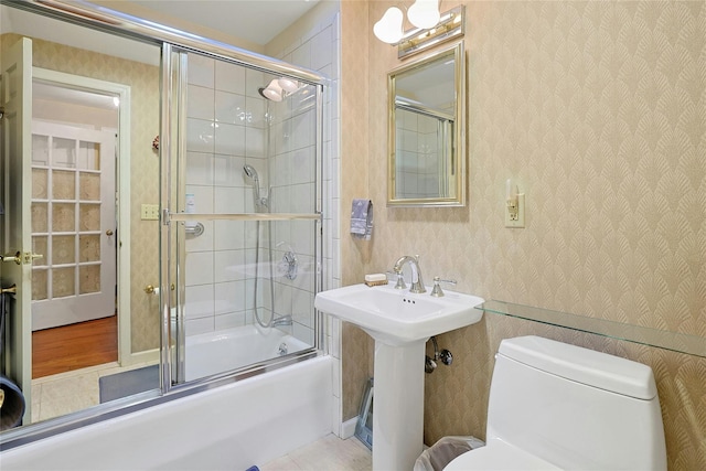 7 Southminster Dr, White Plains, NY 10604 - bathroom featuring toilet, bath / shower combo with glass door, and a sink