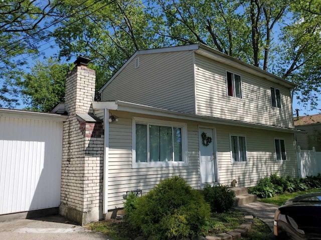 331 Jayne Blvd, Port Jefferson Station, NY 11776 - view of front facade featuring a chimney