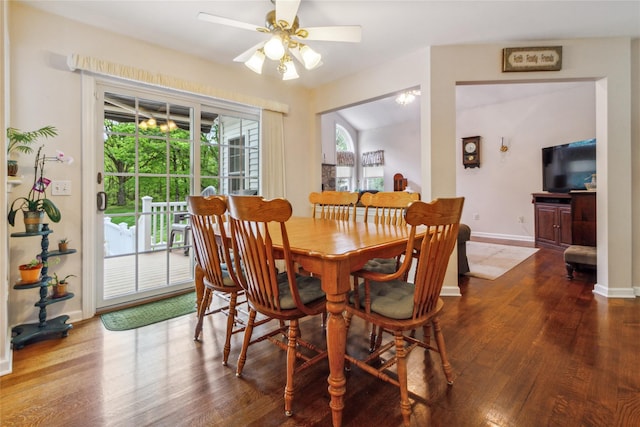 dining area with dark wood finished floors, plenty of natural light, baseboards, and ceiling fan
