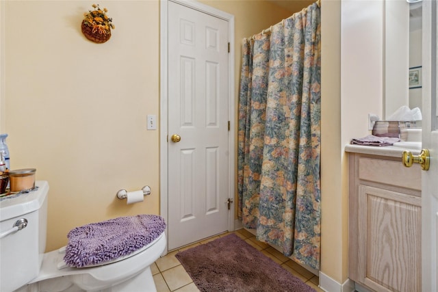full bath with tile patterned floors, toilet, and a shower with curtain