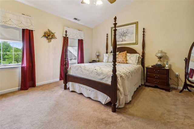 bedroom featuring carpet flooring, vaulted ceiling, baseboards, and ceiling fan